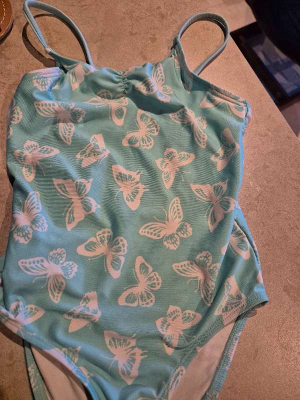 Turkos baddräkt fjärilar