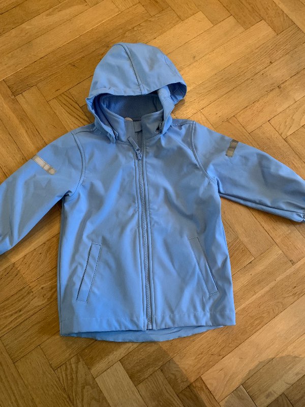 Ny oanvänd softshell jacka