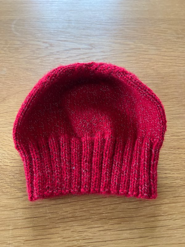 Hem stickad mössa reflex